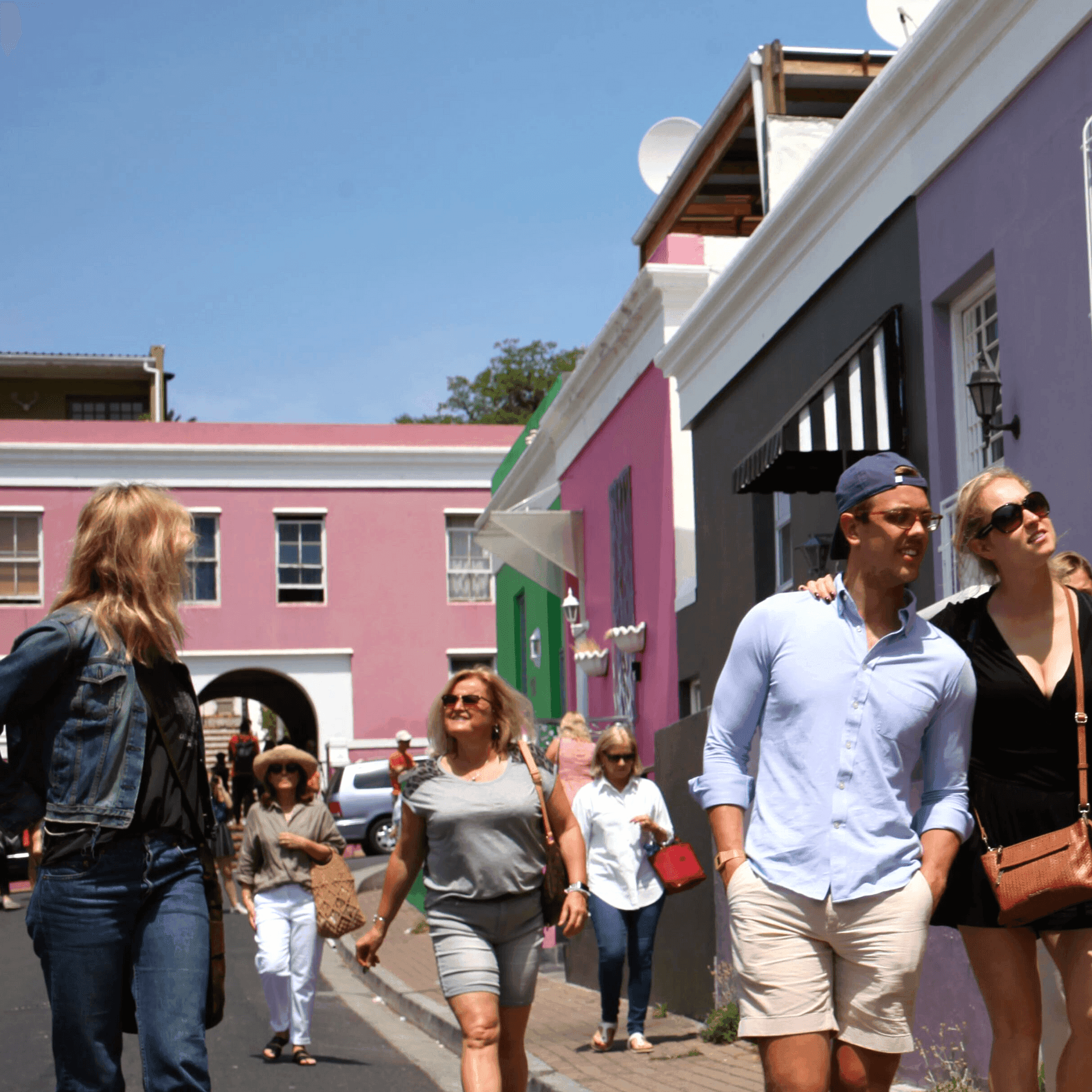 A tour group in Bo-Kaap's colourful Chiappinni Street